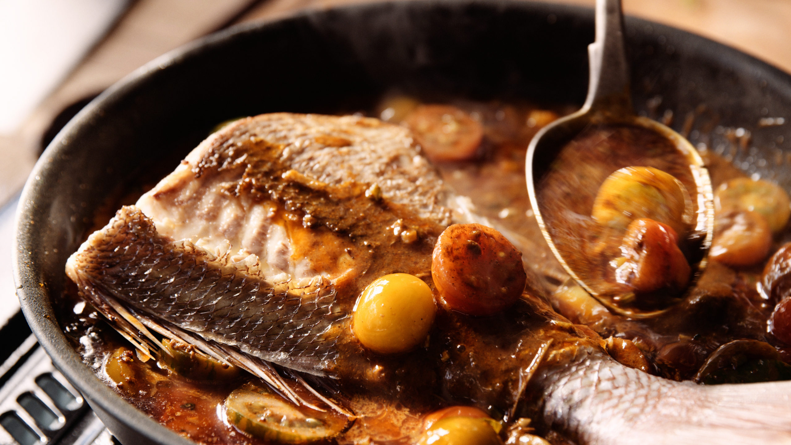 pan of curried snapper and medley tomatoes