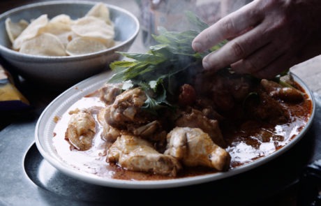 mint leaves on butter chicken